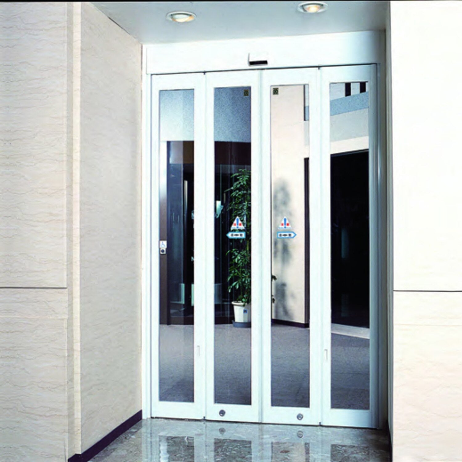 NABCO MINI FOLD automatic folding door set into a narrow interior opening