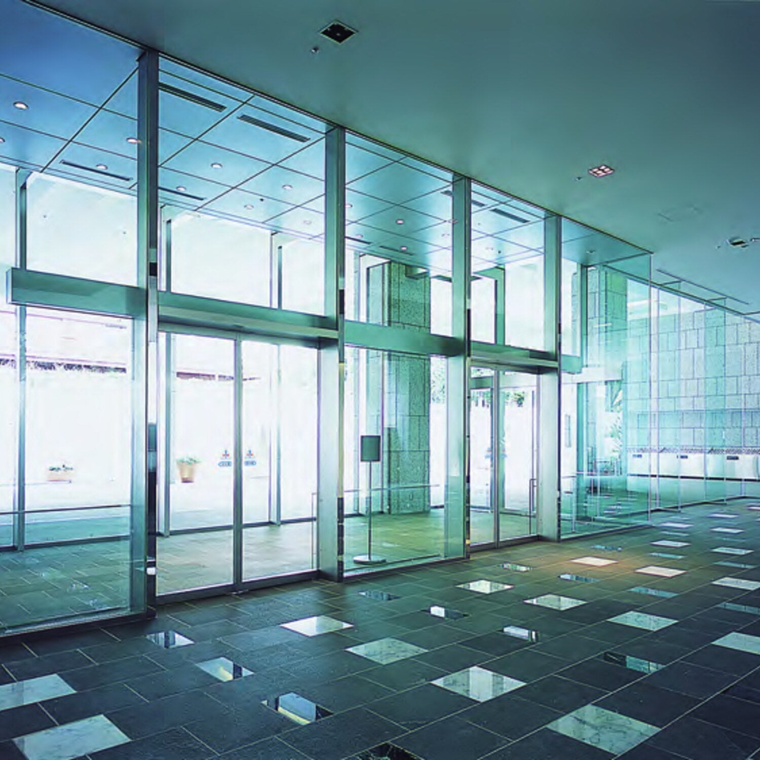 NABCO automatic sliding doors along a glazed building entrance