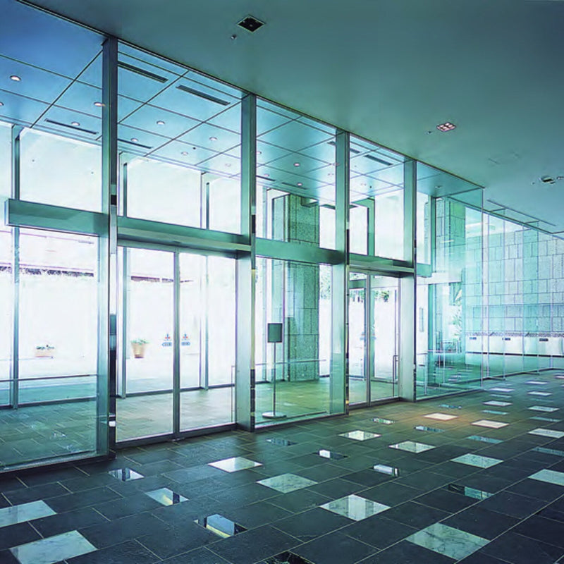 NABCO automatic sliding doors along a glazed building entrance