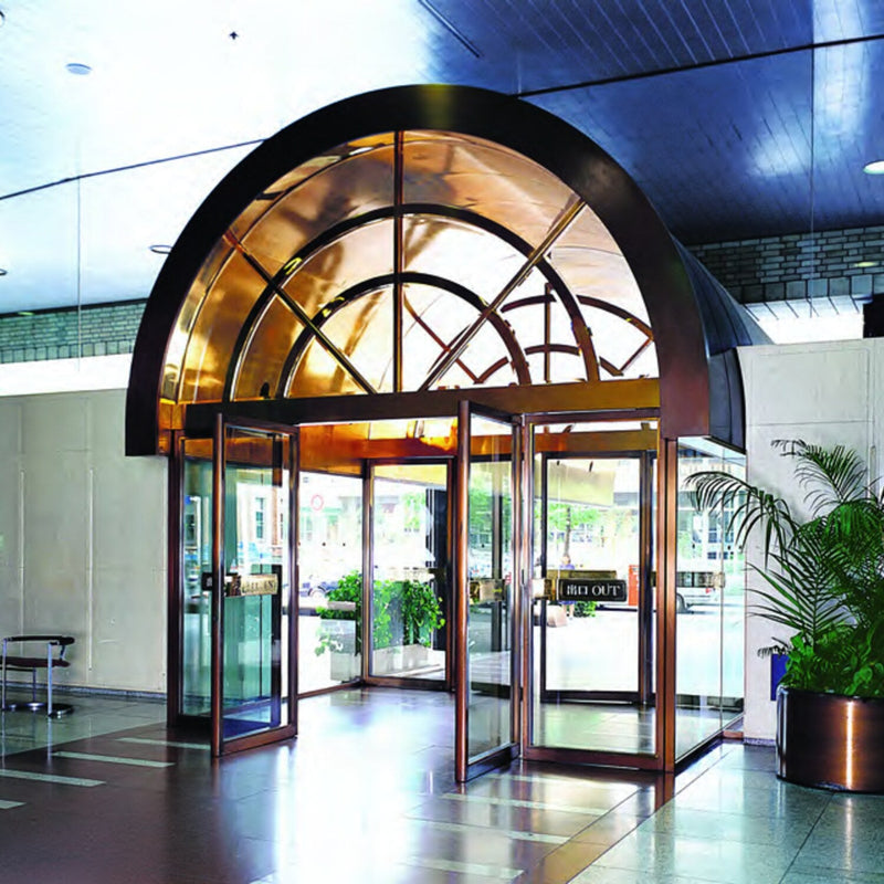 NABCO automatic swing doors under an arched building entrance